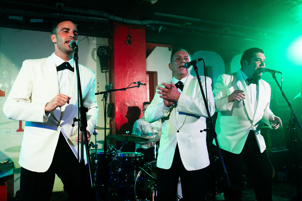 Doo Wop Explosion band members on stage UK live music